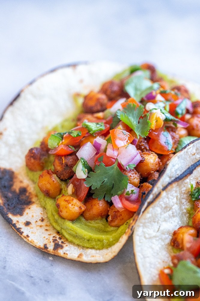Flavorful 15 Minute Chickpea Tacos 5 Close up of a single vegan chickpea taco, beautifully assembled and ready to eat