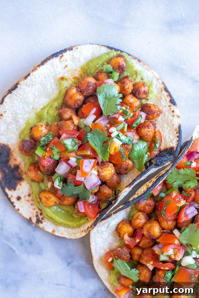 Flavorful 15 Minute Chickpea Tacos 6 A plate of two perfectly crafted 15-minute chickpea tacos, garnished with fresh toppings