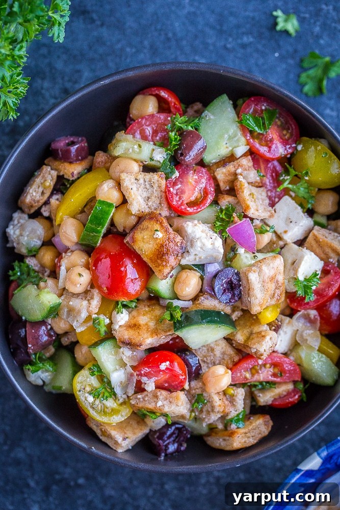 41 Vibrant Summer Salad Ideas 23 Greek Chopped Salad with Crispy Pita, a savory choice.