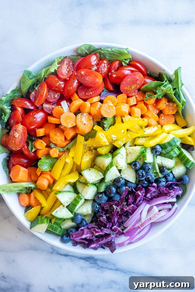 41 Vibrant Summer Salad Ideas 5 Vibrant Rainbow Veggie Salad, full of fresh produce.