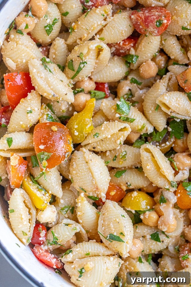 Sun-Kissed Herby Parmesan Tomato Pasta Salad 4 Close-up of the Herby Parmesan Tomato Pasta Salad, vibrant with colors and textures, illustrating its fresh appeal.