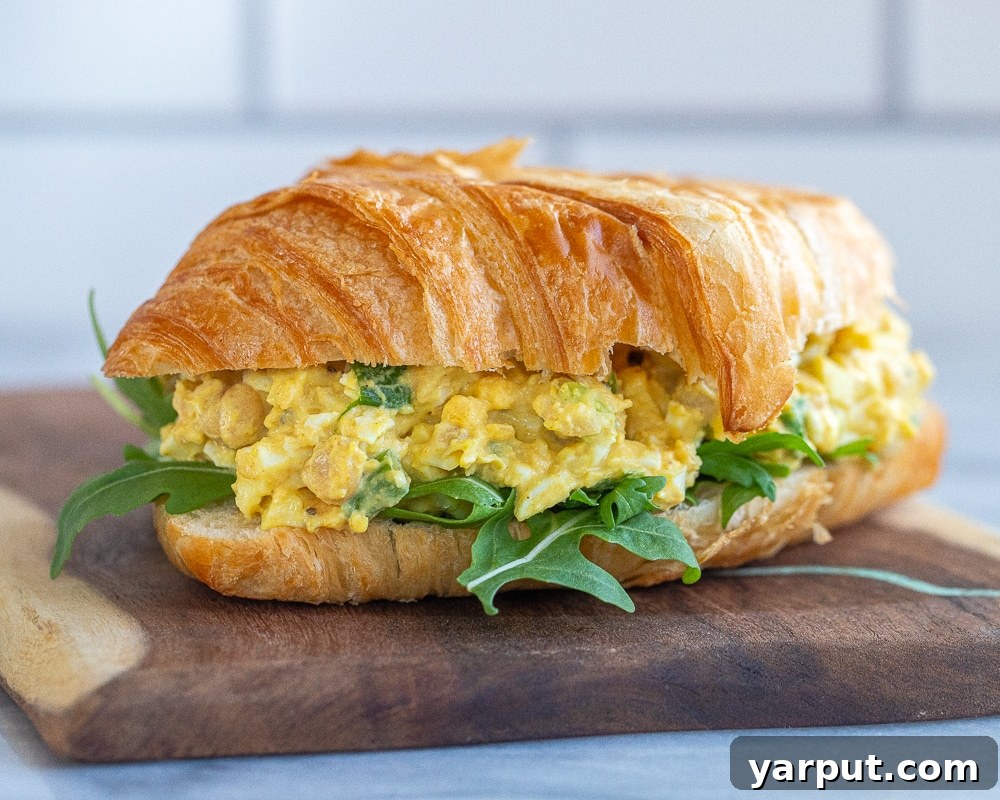 Golden Curried Chickpea & Egg Salad 5 A delicious curried egg salad sandwich with chickpeas, served on thick bread with fresh greens.