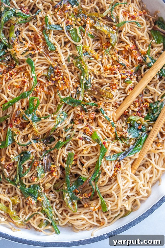 Effortless Vegetarian Meals for Week Two 3 A bowl of Easy Scallion Soy Noodles, garnished with fresh green onions.