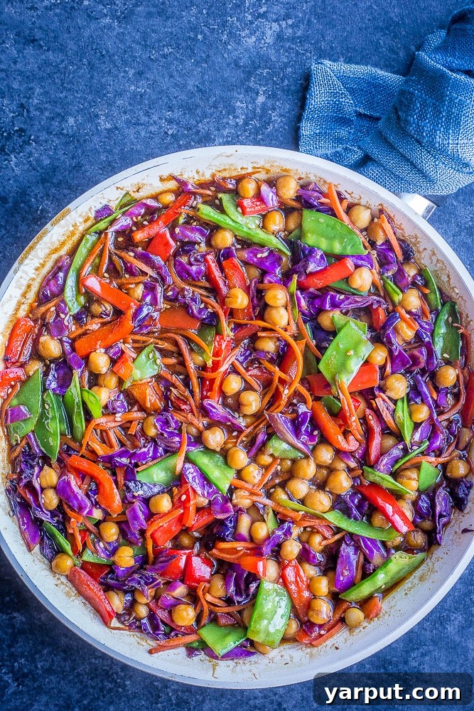 Quick & Easy Vegetarian Meal Plan - Week 4 6 A vibrant and colorful Clean Out The Refrigerator Vegetable Stir Fry served over rice, showcasing a variety of fresh vegetables for a healthy and versatile meal.