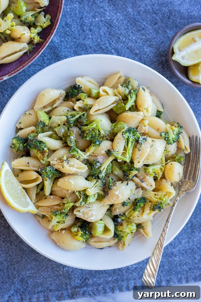 Golden Roasted Broccoli and Garlic Parmesan Pasta 5 garlic parmesan pasta with roasted broccoli recipe in a bowl with a lemon slice
