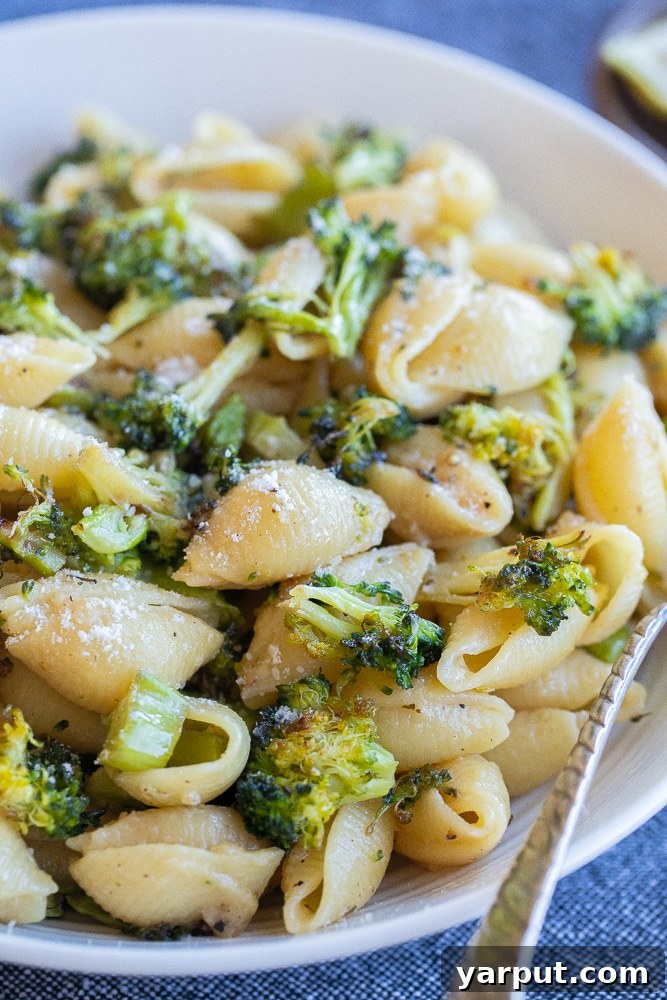 Golden Roasted Broccoli and Garlic Parmesan Pasta 6 close up of a bowl of garlic parmesan pasta with broccoli and lemon
