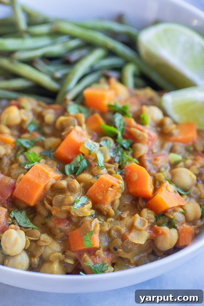 Creamy One-Pot Coconut Lentil Chickpea Curry 6 Close-up of a bowl of delicious lentil chickpea coconut curry