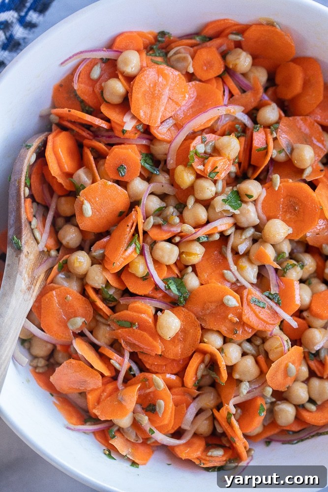 Maple Orange Glazed Carrot & Chickpea Medley 5 close up of a bowl of carrot and chickpea salad with an orange maple dressing