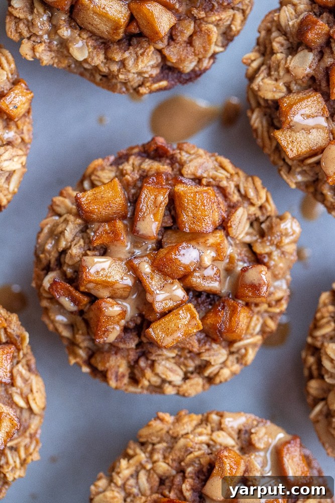 Close-up of golden Caramelized Apple and Peanut Butter Baked Oatmeal Cups, perfectly baked and ready to enjoy.