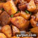 Quick and Easy Home Fries in a serving bowl, garnished