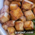 Crispy Pan-Fried Tofu cubes in a serving bowl.