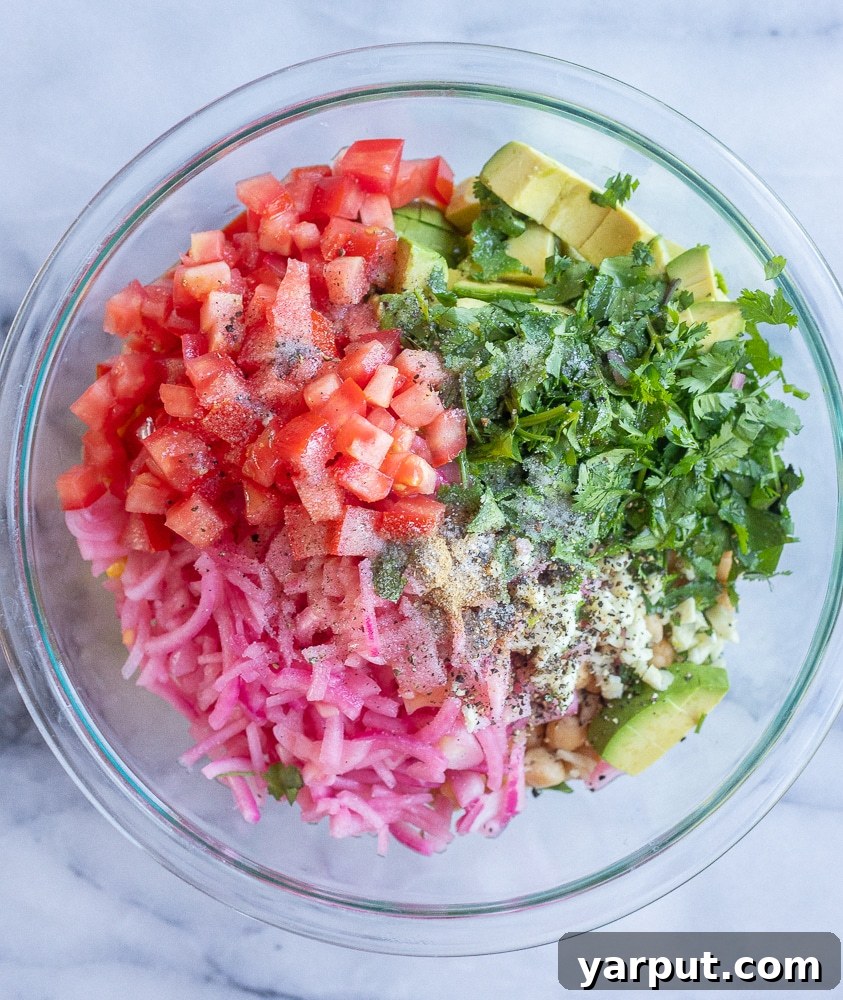 Tangy Avocado and Cucumber Salad with Pickled Onions 3 All the fresh ingredients meticulously arranged, showcasing the vibrant colors of cucumber, corn, tomatoes, avocado, and pickled red onions, ready for the Pickled Onion and Avocado Salad.