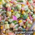 A serving of Pickled Onion and Avocado Salad with Cucumber