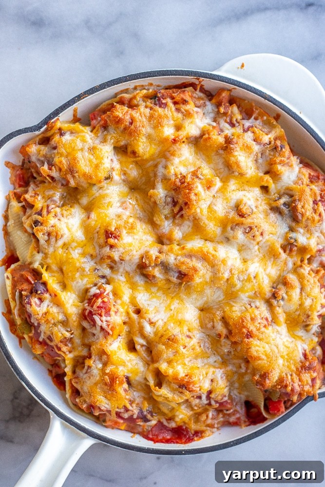 Delicious baked chili cheese stuffed shells in a baking dish, ready to be served