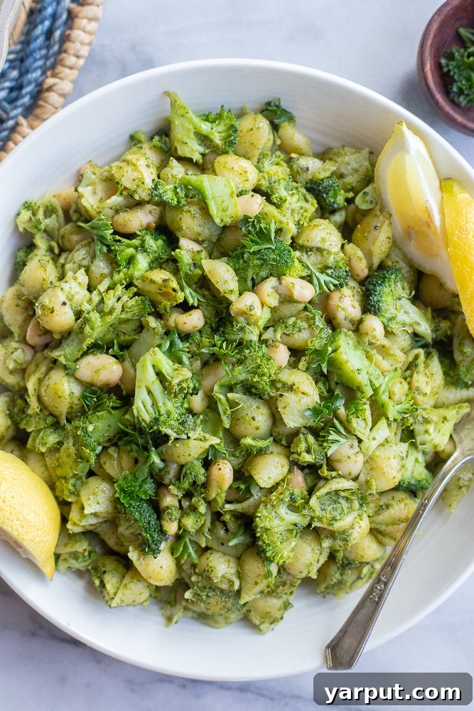 Pocket-Friendly Plant-Based Meals - Week 18 3 Pesto Pasta with Broccoli and White Beans, a quick and healthy vegetarian dinner.