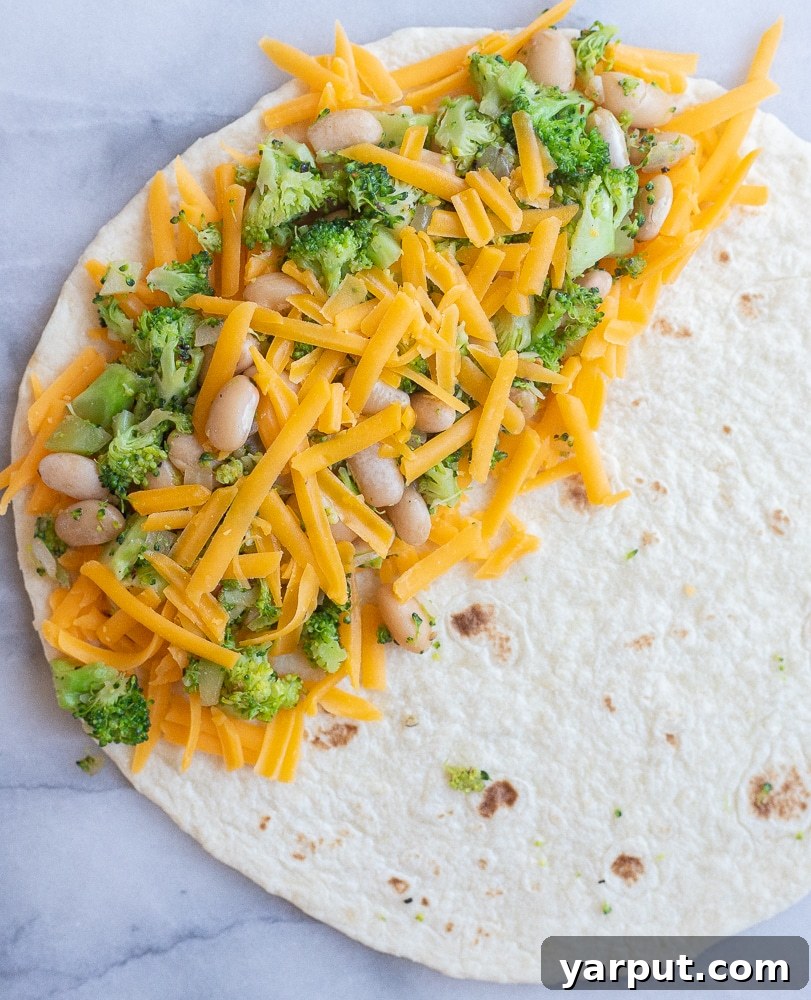 Creamy Broccoli, Cheddar, and White Bean Quesadillas 4 Assembling Broccoli Cheddar and White Bean Quesadillas before cooking, with filling ready to be folded