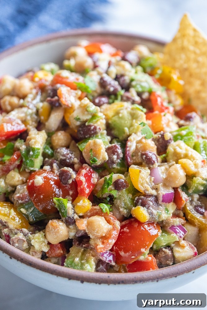 close up of loaded black bean salad in a bowl