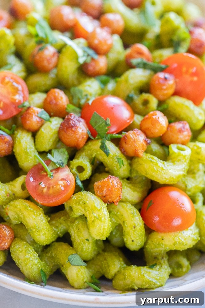 Vibrant Lemon Jalapeno Pasta with Crispy Chickpea Crunch 5 A close-up view of Herby Lemon Jalapeno Pasta showcasing the creamy green sauce, visible herb flecks, and perfectly crispy chickpeas.