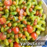 A small image of Herby Lemon Jalapeno Pasta with Crispy Chickpeas and cherry tomatoes.