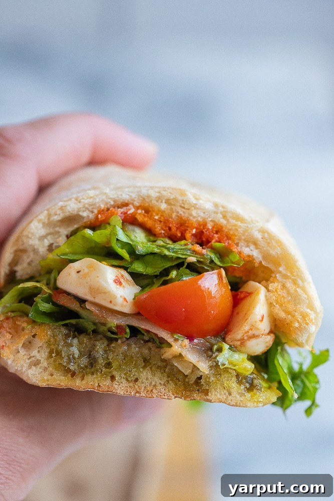 Budget Friendly Meal Plan for Week 21 4 Fresh and delicious Caprese salad sandwich with ripe tomatoes, mozzarella, and basil.