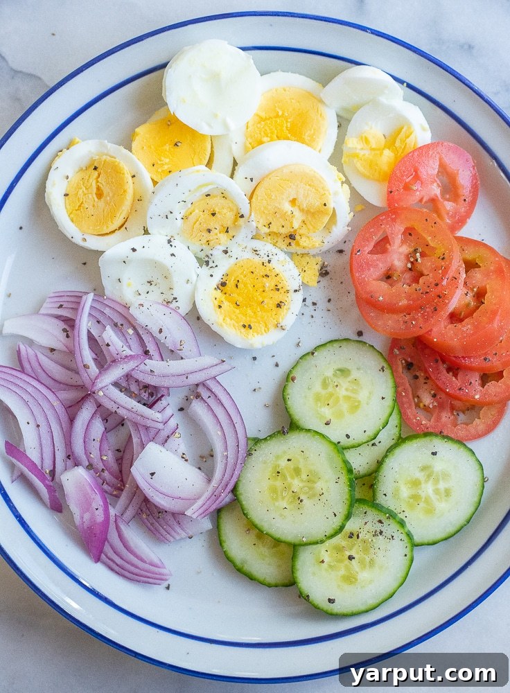 Veggie Morning Pockets 4 a plate of hard boiled eggs and sliced vegetables for the pitas