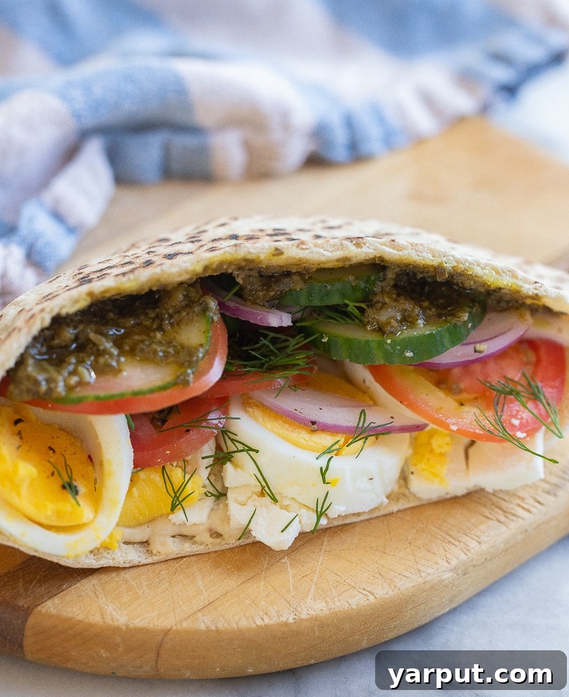 Veggie Morning Pockets 5 a vegetarian breakfast pita on a cutting board