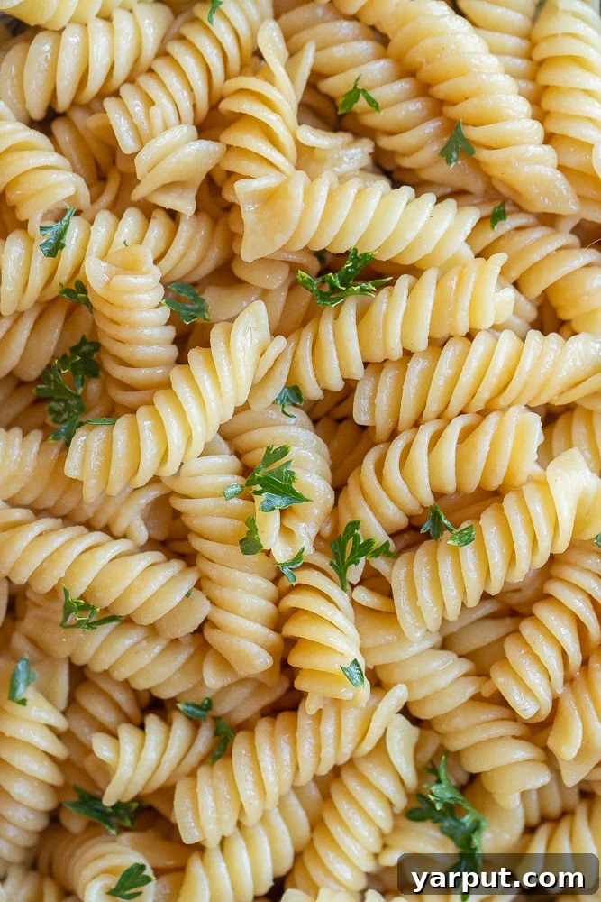 Effortless Butter Noodles Kids Adore 5 close up of kid friendly butter noodles with parsley