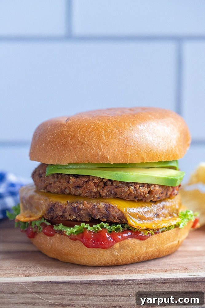 Crispy Black Bean Smash Burgers 5 black bean veggie burger with melted cheese on a cutting board
