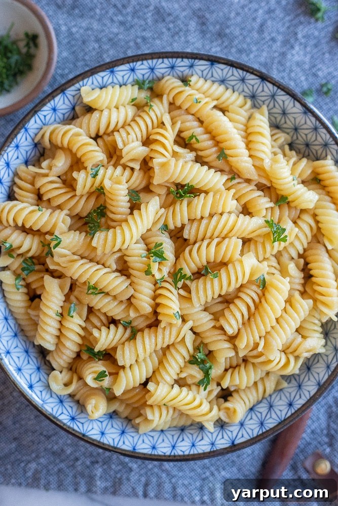 A simple yet satisfying bowl of butter noodles, ready for customization.