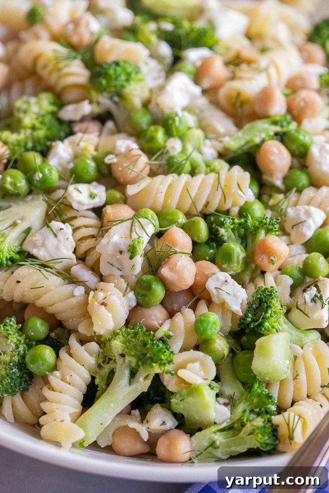 Zesty Lemon Broccoli Feta Pasta Salad 6 close up of a bowl of pasta salad with lemon, dill and feta cheese