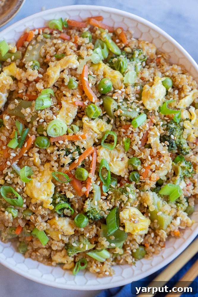 Your New Go-To Quinoa Fried Rice 6 A large bowl of delicious Quinoa Fried Rice, showcasing its wholesome ingredients.