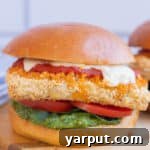 Vegetarian Tofu Parmesan Sandwich on a cutting board