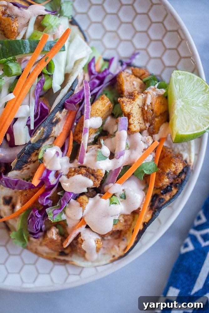 Creamy Zesty Fish Taco Sauce 6 Delicious tofu tacos generously drizzled with homemade creamy fish taco sauce, garnished with fresh cilantro.