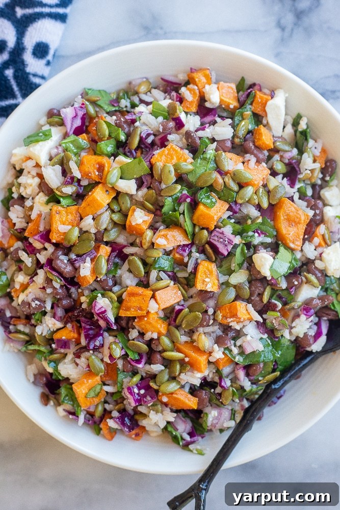 Spooky Rice and Veggie Medley 2 Healthy Halloween salad in a bowl with a skull and cross bones napkin, vibrant and appetizing