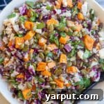 Close up shot of the Halloween Salad with Rice and Veggies in a small black bowl, ready to be served.