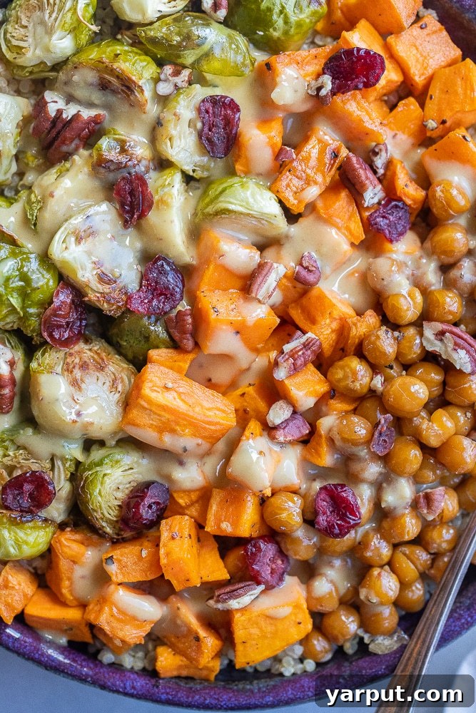 Crispy Roasted Brussels Sprout Bowls with Creamy Honey Mustard Dressing 5 close up of roasted veggie bowl topped with creamy tahini honey mustard dressing