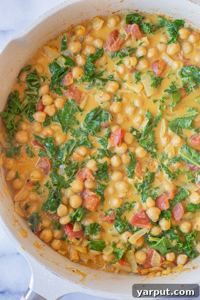 pan of chickpea coconut curry with kale