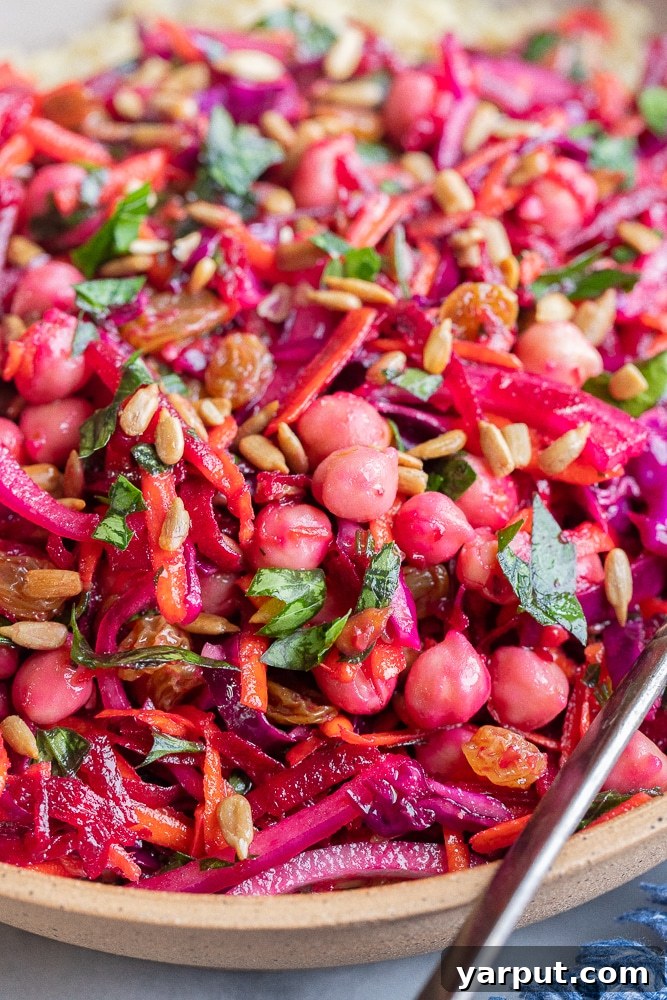 Vibrant Root and Chickpea Power Salad 5 close up of a beautiful beet salad with carrots, cabbage and chickpeas