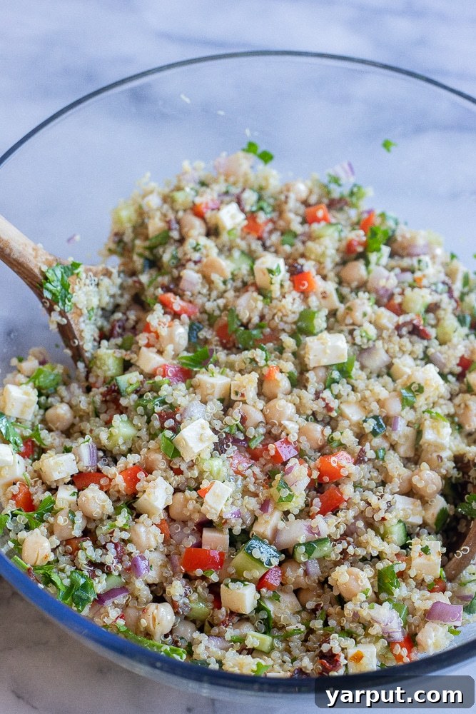 The Ultimate Easy Quinoa Salad 4 A vibrant vegetarian quinoa salad, perfectly mixed and presented in a rustic serving bowl, showcasing its rich textures and appealing colors before serving.
