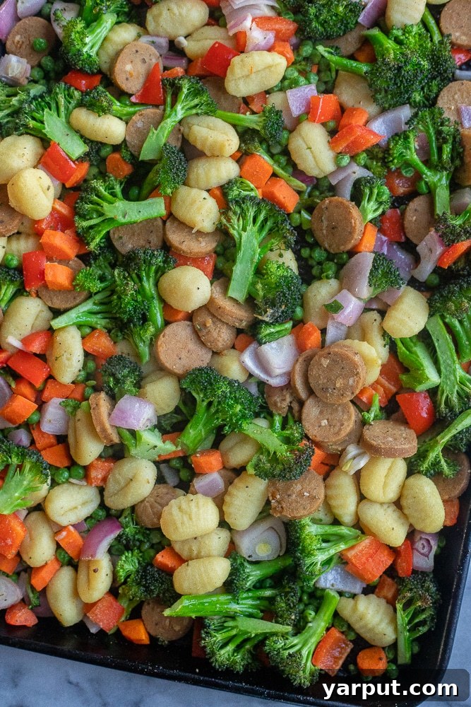 Rustic Sausage, Gnocchi, and Roasted Vegetable Casserole 4 Roasted vegetable gnocchi and sausage bake just removed from the oven, showing golden gnocchi and caramelized vegetables.