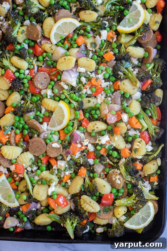 Rustic Sausage, Gnocchi, and Roasted Vegetable Casserole 5 Sheet pan gnocchi dinner with roasted vegetables and vegetarian sausage, ready to be served.