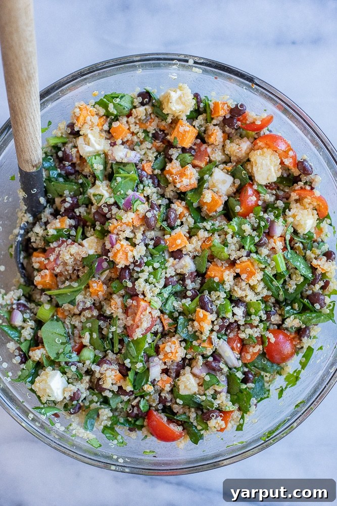Fully mixed Loaded Quinoa and Black Bean Salad in a bowl, showcasing its vibrant and appetizing texture.