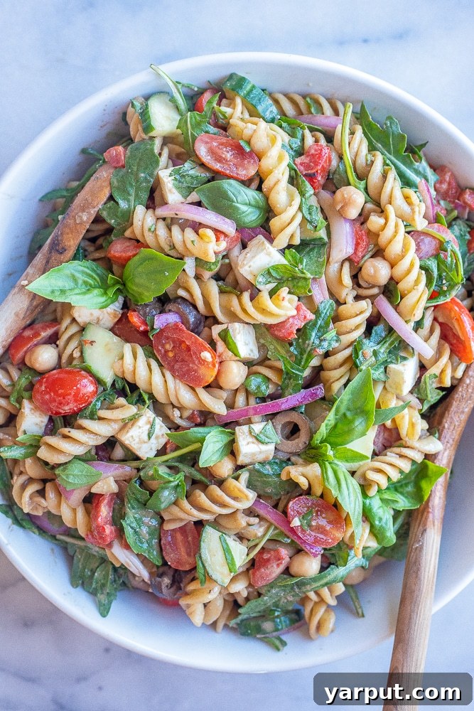 Fresh arugula in a bowl, showcasing its vibrant green leaves and inviting texture.