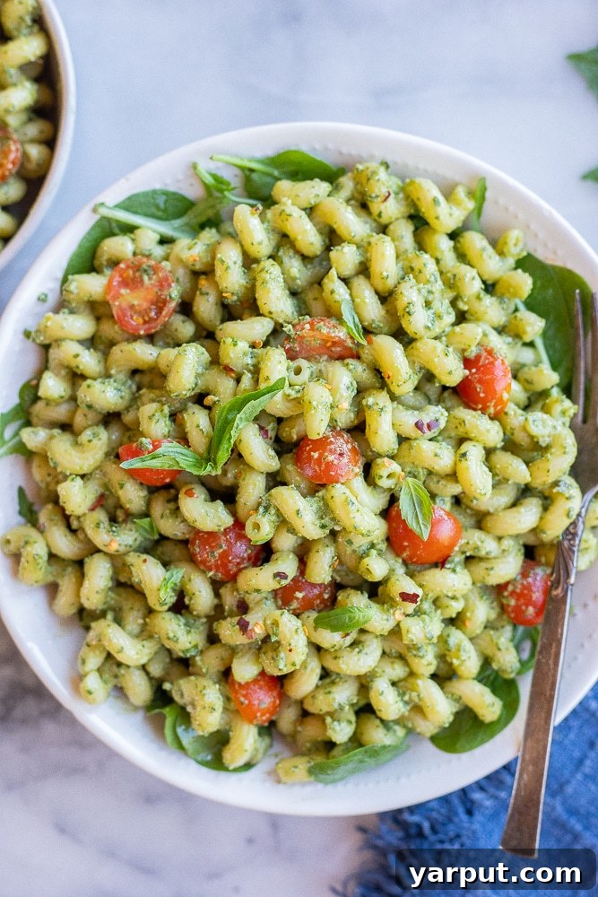 Plant-Powered Week Six Meal Guide 4 Creamy Vegan Avocado Pesto Pasta with fresh cherry tomatoes
