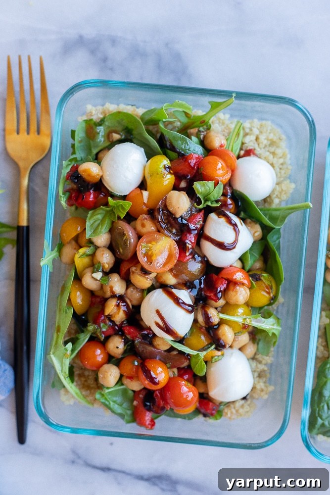Caprese Quinoa Power Bowls 5 Vegetarian Caprese Quinoa Meal Prep Lunch Bowl with a fork, ready to be enjoyed.