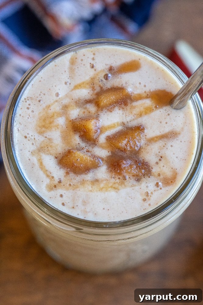 Luscious Caramel Apple Smoothie 6 A vibrant and inviting close-up of a caramelized apple smoothie, showcasing its smooth texture and rich color, ready to be enjoyed.