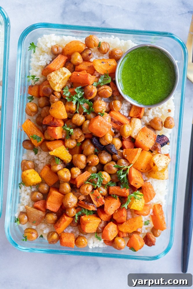 Effortless Vegetarian Meal Plan: Week 7 3 Close-up of vibrant Roasted Carrot Couscous Bowls with a drizzle of green tahini sauce and fresh parsley.