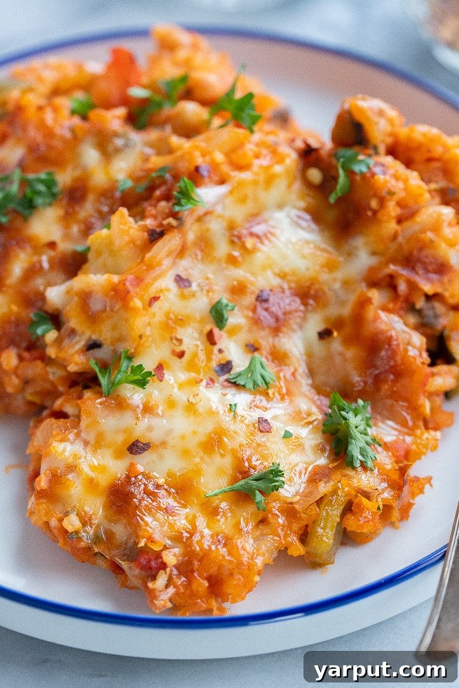 Veggie Pizza Bake with White Beans and Rice 7 A beautifully presented serving of vegetarian pizza casserole, ready to be enjoyed as a hearty and comforting meal