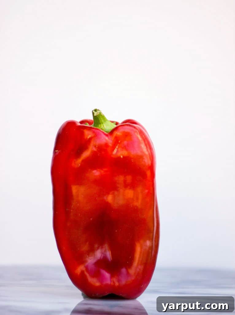 Homemade Gluten Free Vegan Roasted Red Pepper Enchilada Sauce 3 Fresh red bell peppers ready for roasting, key ingredient for enchilada sauce