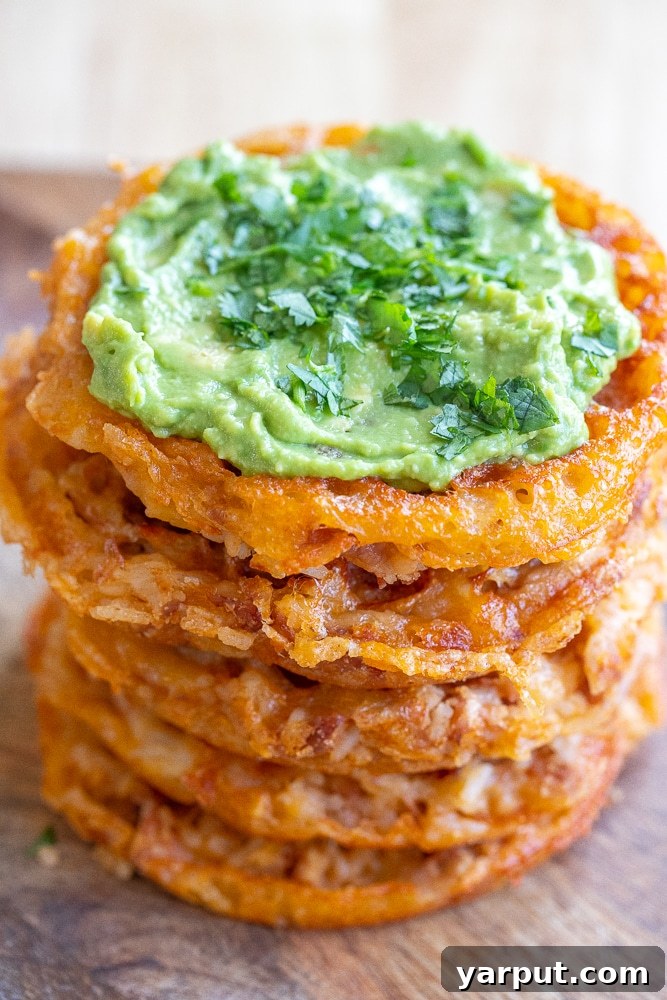 Savory Cheesy Rice and Bean Waffles 2 Delicious Cheesy Rice and Bean Waffles stacked on a plate, ready to be enjoyed.